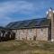 ...Kirche..mit Solarpanells in christlicher Symbolik....